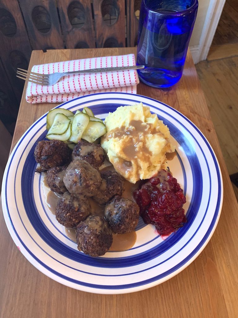 Swedish meatballs topped with gravy and served with mashed potatoes